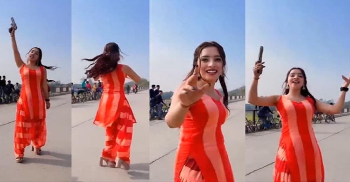 অস্ত্র হাতে হাইওয়ের মাঝে তরুণীর নাচ, ভিড়িও ভাইরাল