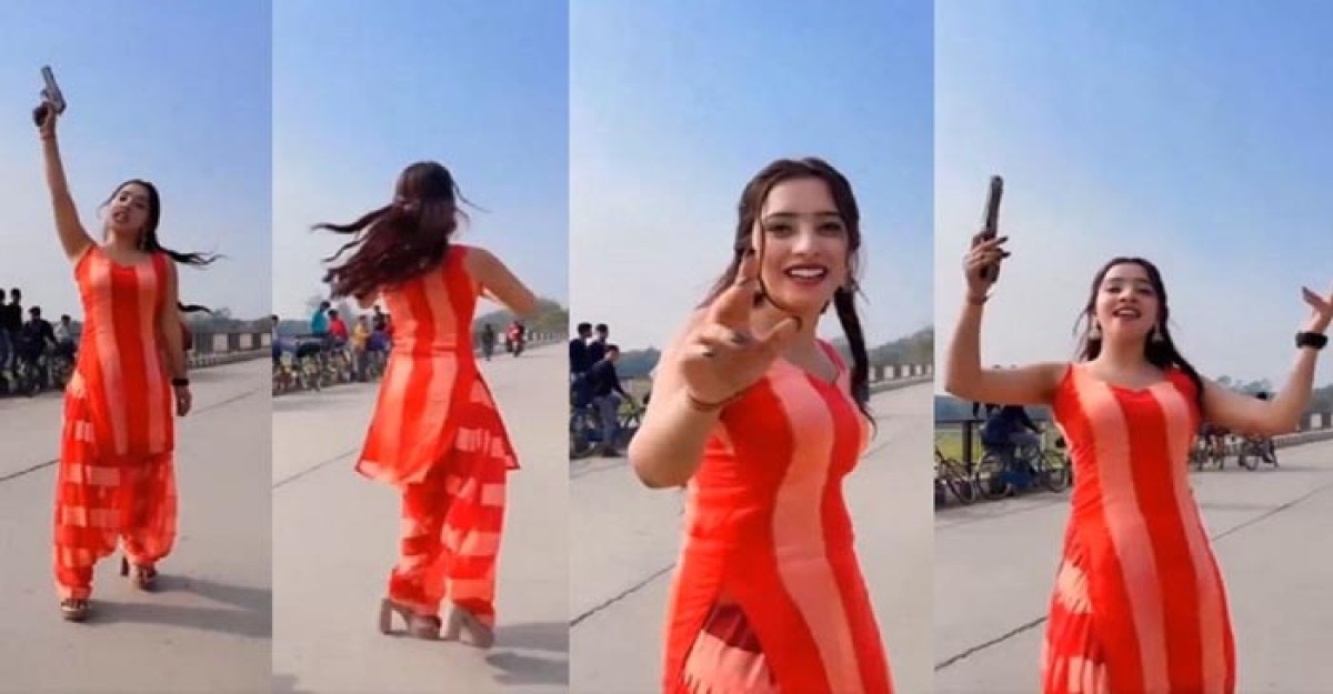 অস্ত্র হাতে হাইওয়ের মাঝে তরুণীর নাচ, ভিড়িও ভাইরাল